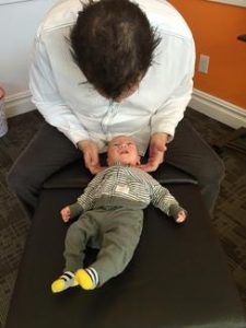 Dr. Josh Adjusting a Baby